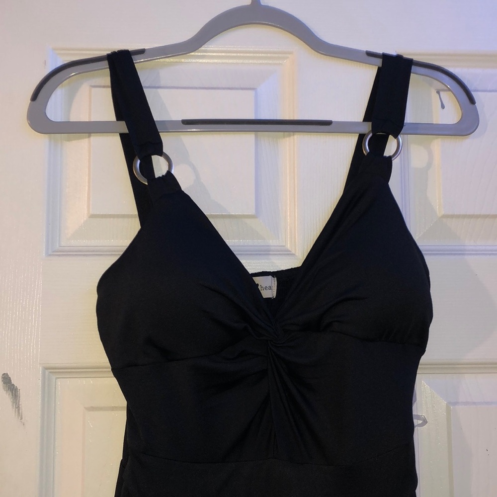 black sleeveless romper, comes from a smoke free and pet free home